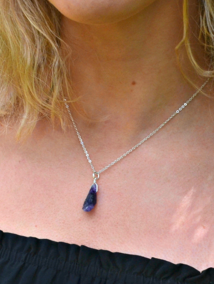 Raw amethyst necklace on silver chain, Natural amethyst gemstone necklace, Handmade raw amethyst pendant, Unpolished amethyst crystal jewelry, Raw amethyst pendant, Amethyst healing crystal necklace, Purple amethyst necklace, Minimalist raw amethyst charm, Boho raw amethyst gemstone jewelry, Genuine amethyst necklace gift, Amethyst pendant with silver chain, Ethereal purple gemstone necklace, Amethyst Rough Pendant Silver Necklace, Raw Amethyst Necklace, February Birthstone, Peace Stone.
