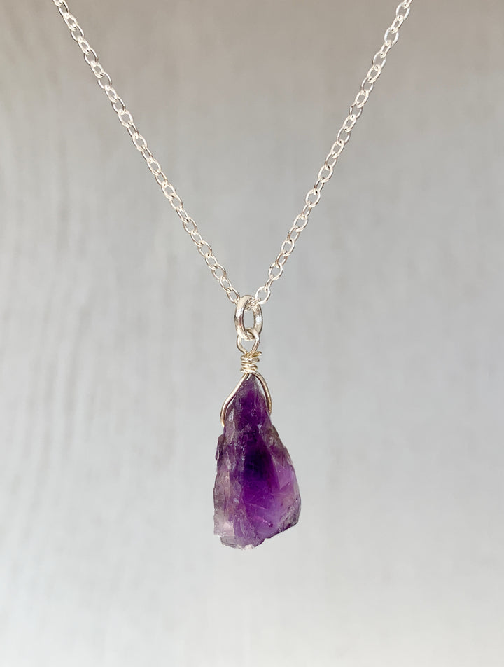 Raw amethyst necklace on silver chain, Natural amethyst gemstone necklace, Handmade raw amethyst pendant, Unpolished amethyst crystal jewelry, Raw amethyst pendant, Amethyst healing crystal necklace, Purple amethyst necklace, Minimalist raw amethyst charm, Boho raw amethyst gemstone jewelry, Genuine amethyst necklace gift, Amethyst pendant with silver chain, Ethereal purple gemstone necklace, Amethyst Rough Pendant Silver Necklace, Raw Amethyst Necklace, February Birthstone, Peace Stone.