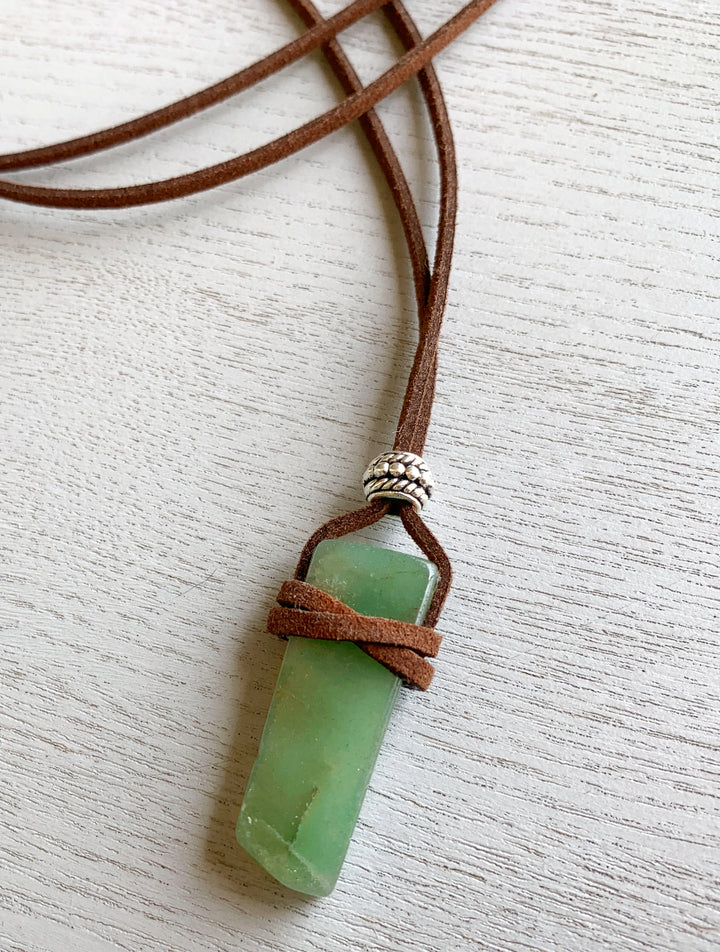 Aventurine necklace with adjustable faux leather suede cord, Bohemian style Aventurine crystal pendant, Elegant Aventurine pendant necklace with gold detailing, Aventurine necklace, Handmade Aventurine necklace in eco-friendly packaging, Green Aventurine pendant necklace for chakra healing.